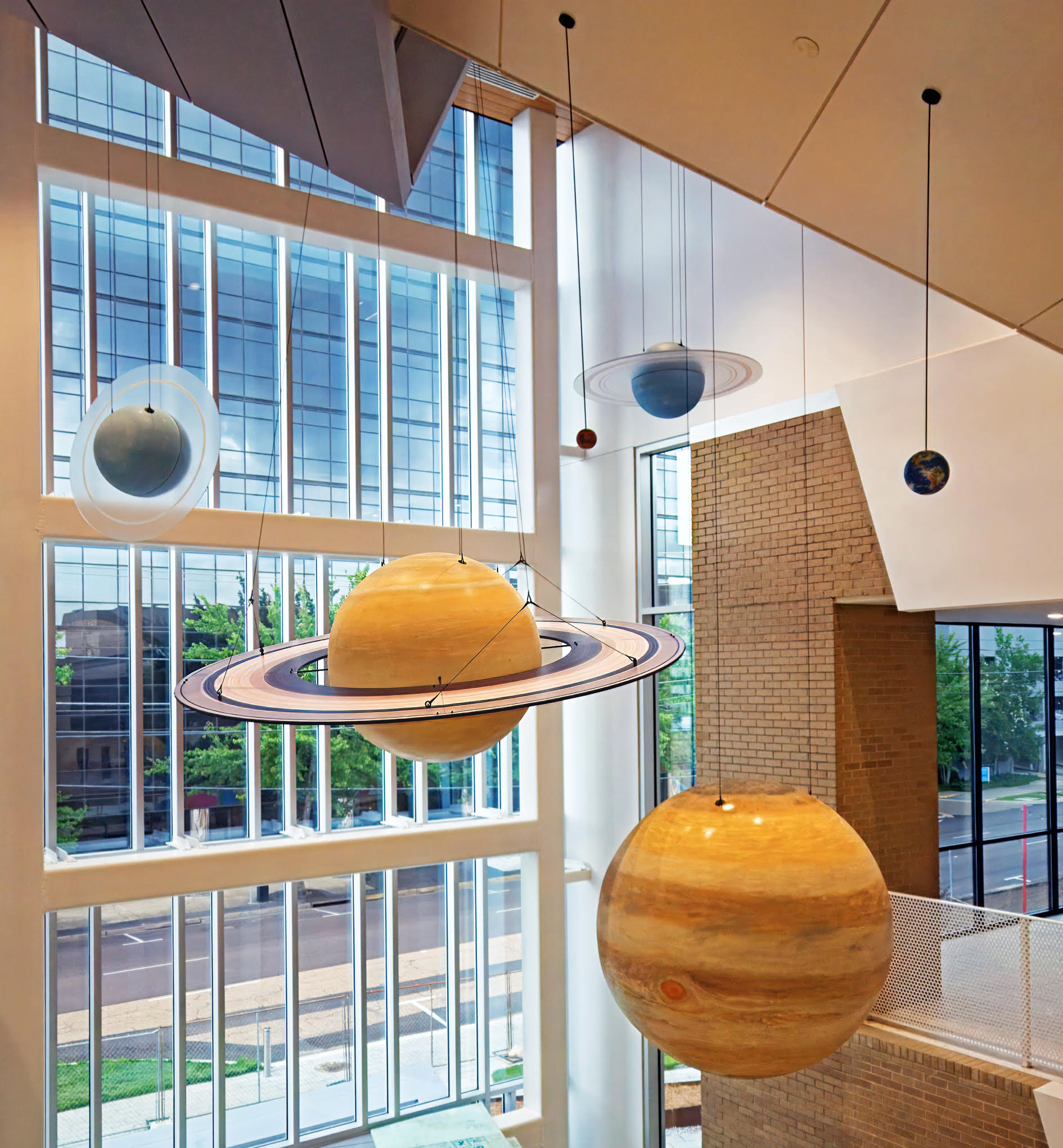 Saturn and Jupiter models hanging in the lobby atrium